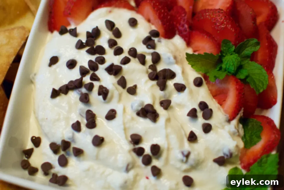 Served cannoli dip with tortilla chips and strawberries