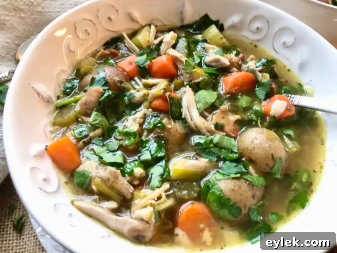 Served Slow Cooker Chicken Soup with Bacon & Potatoes in a deep bowl