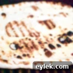 The Ultimate Grilled Pizza Crust 7 Crispy grilled pizza crust on a tray