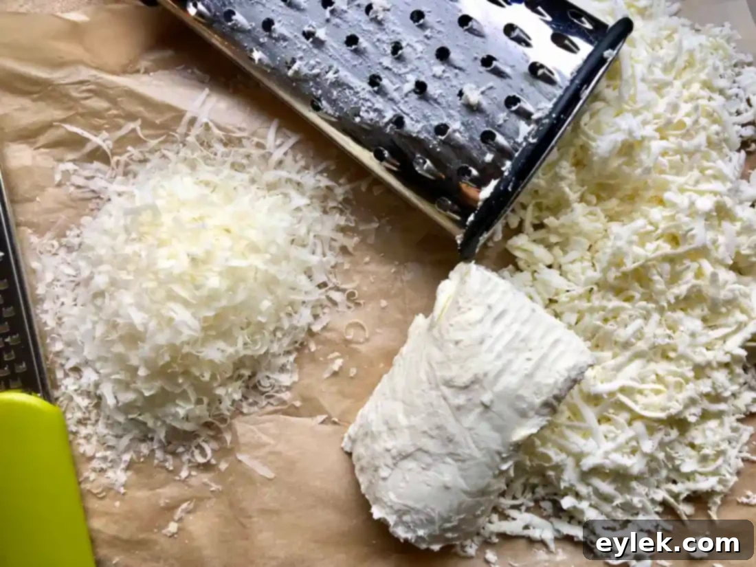 A mix of freshly grated Parmesan Reggiano and shredded fresh mozzarella cheese, prepared for layering in the lasagna spirals recipe.