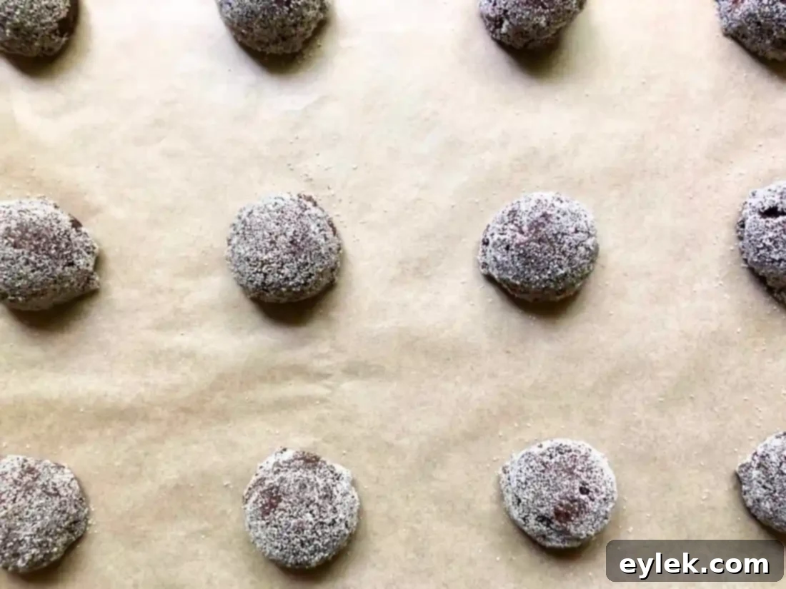 cookie dough balls on parchment paper