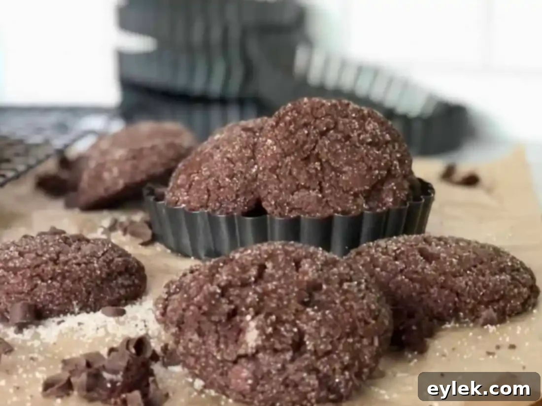close up of ultra-dark chocolate crackle cookie