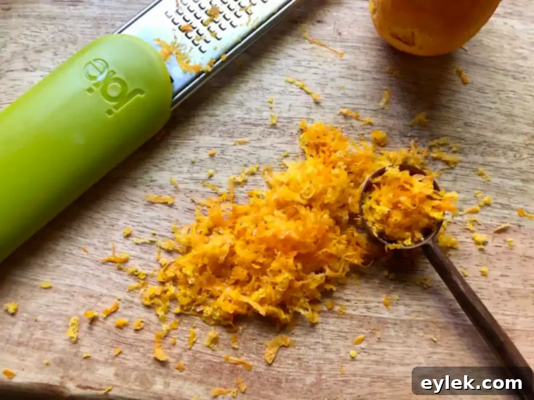 orange zest being added to cookie ingredients