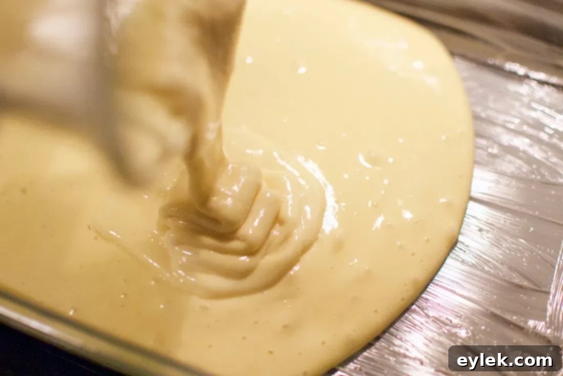 Tres Leches Cake batter in a baking pan