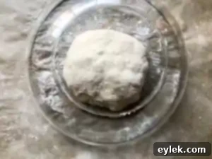 Shaped dough resting under an overturned bowl