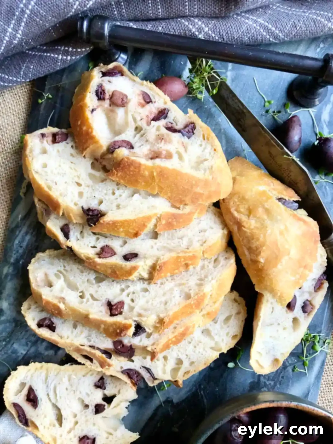 Close-up of a rustic loaf of Quick & Easy No-Knead Olive Bread