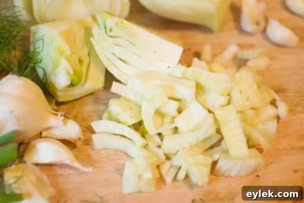 Slices of fresh fennel bulb on a cutting board