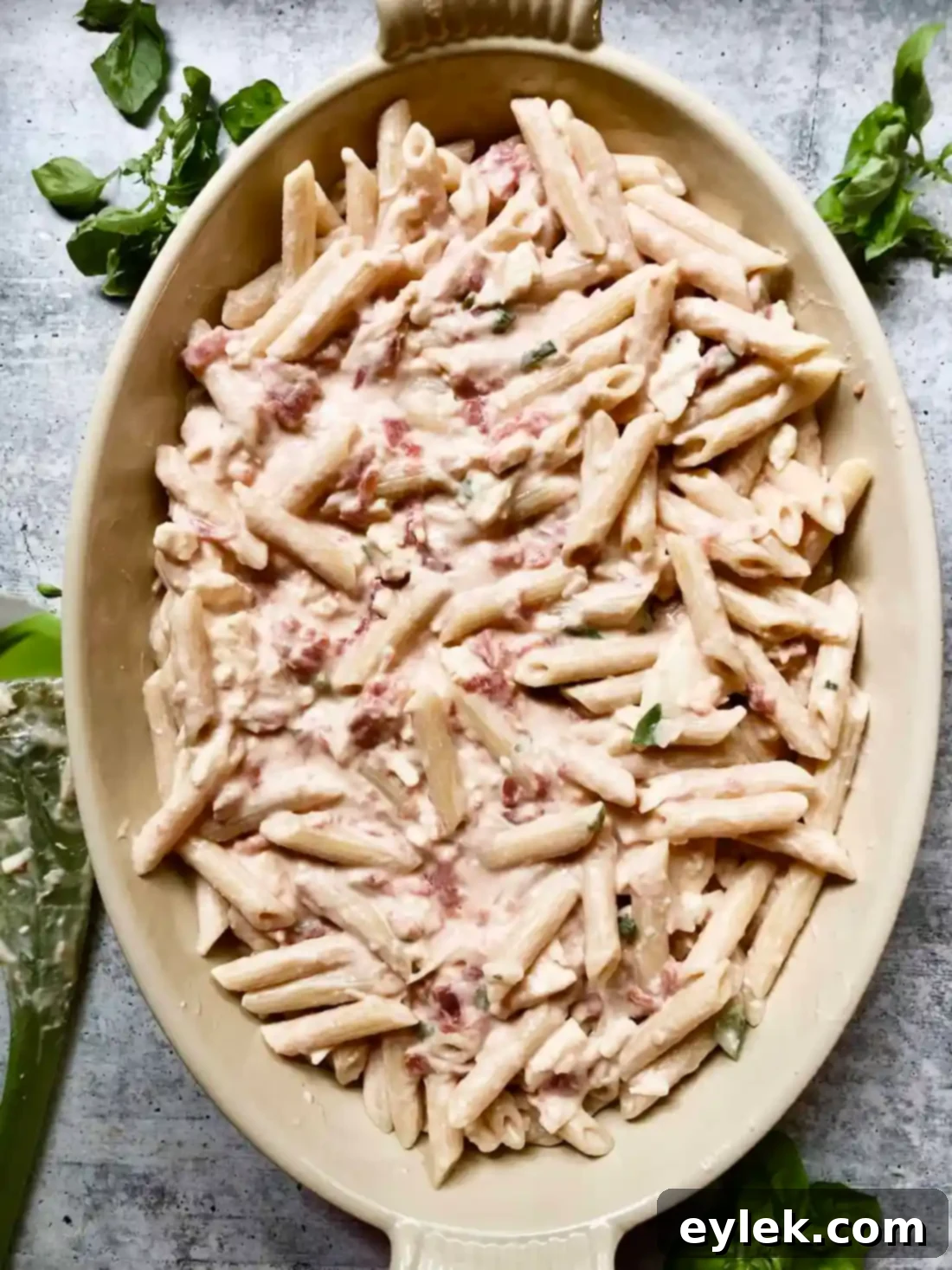 The Penne with Tomato, Cream & Five Cheeses, freshly baked and serving as a delicious, warm meal.