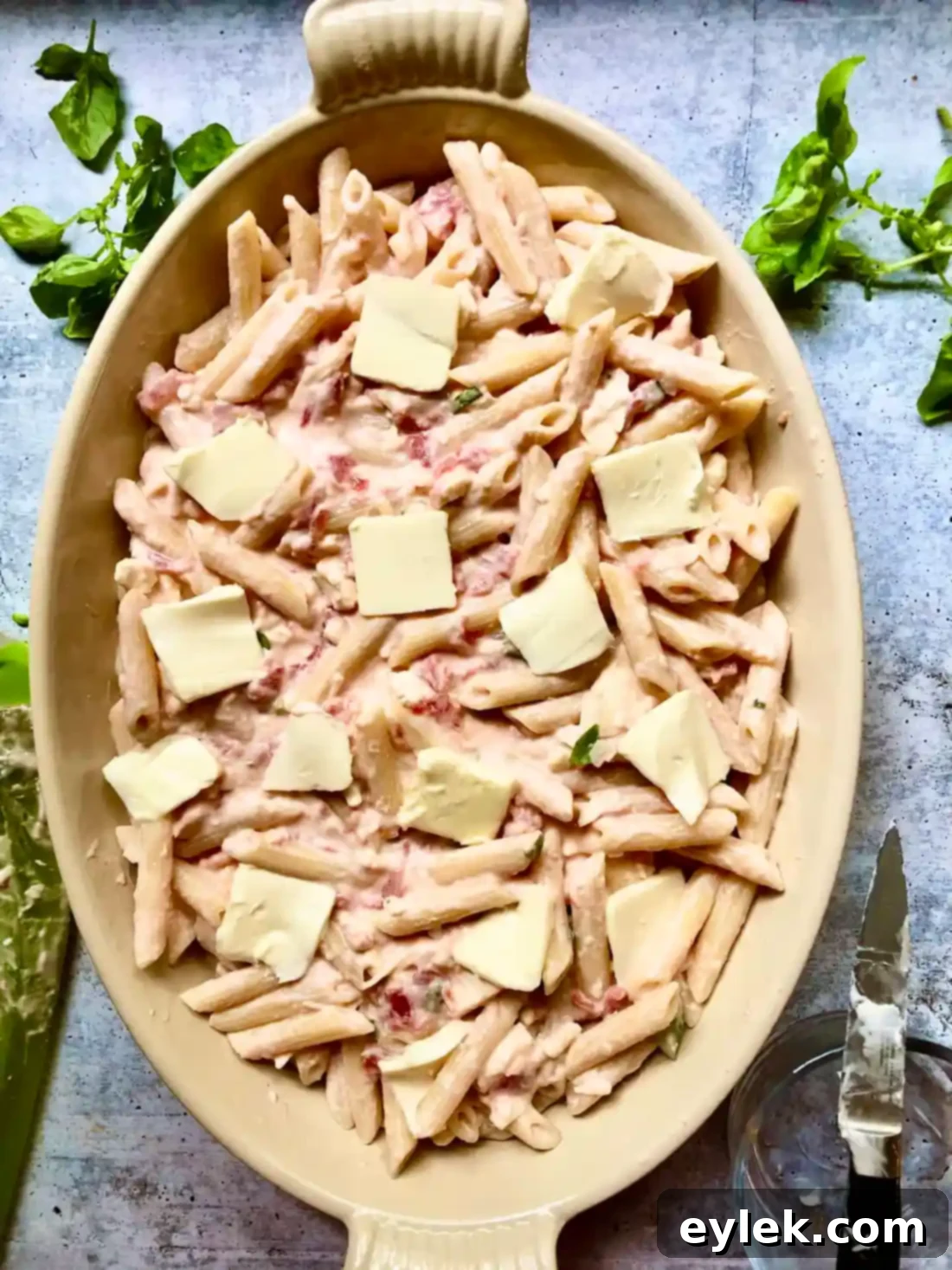 A close-up of the crispy, cheesy top layer of the baked Penne with Tomato, Cream & Five Cheeses.