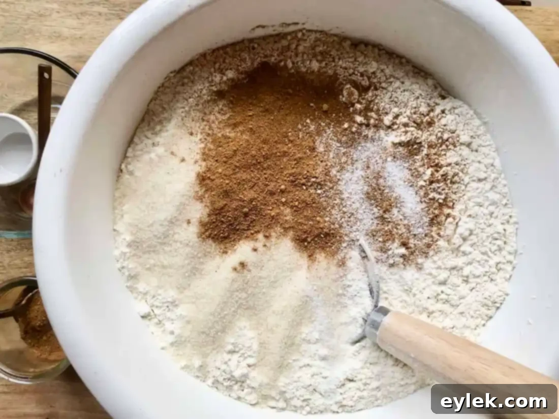 whisking dry ingredients for pumpkin rolls