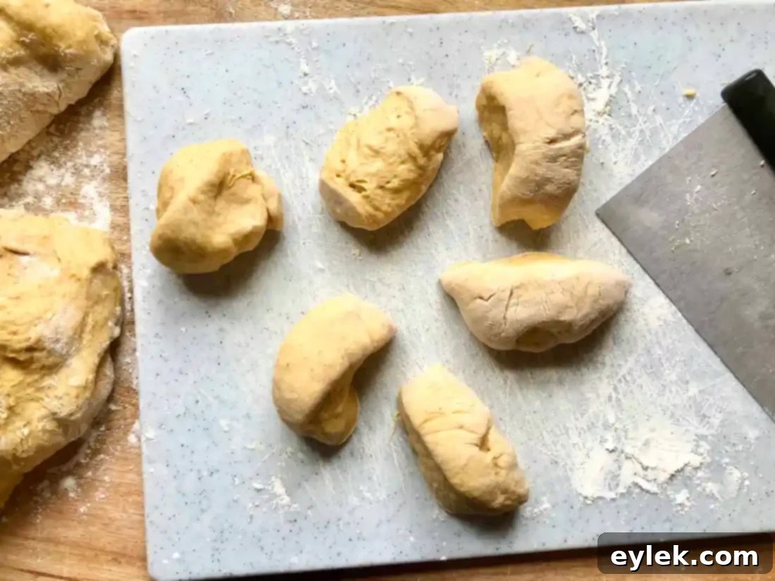 shaped pumpkin rolls in baking pan