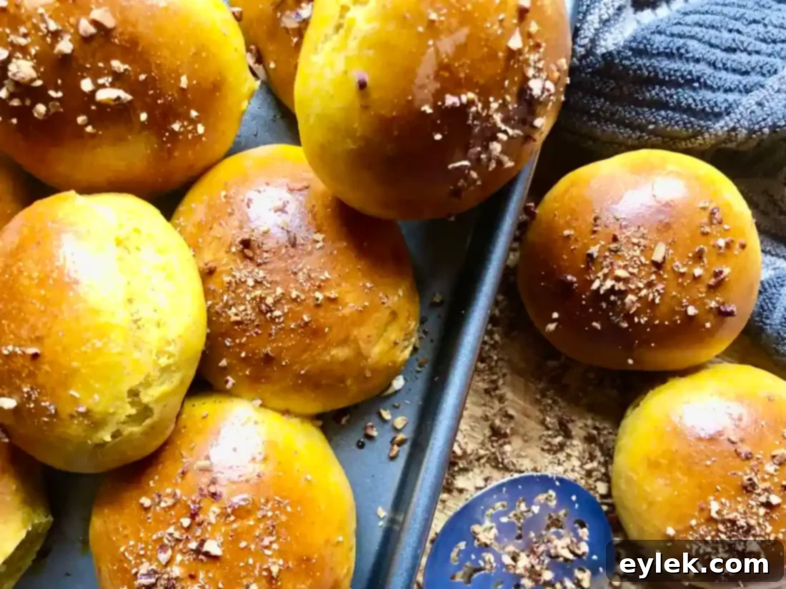 close up of warm pumpkin rolls with butter