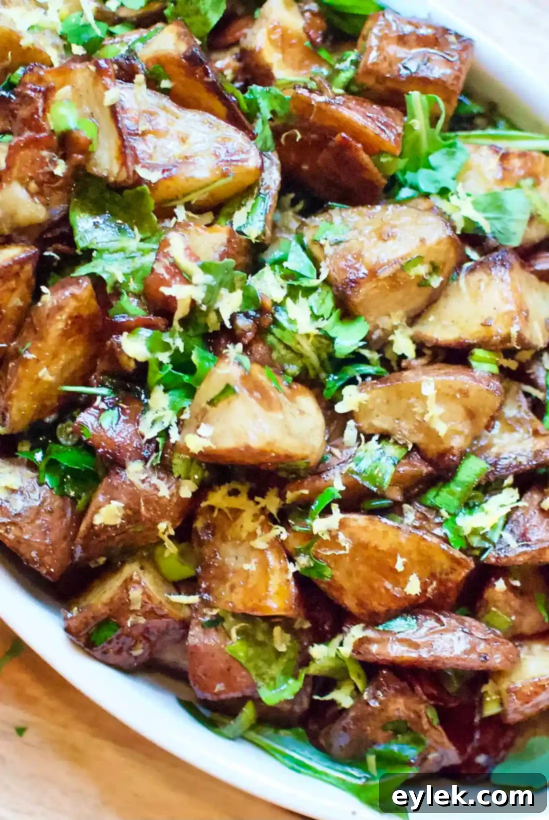 Balsamic Roasted Potato Salad close-up, highlighting the dressing and fresh ingredients