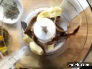 Garlic, anchovies, and capers blending for the puree