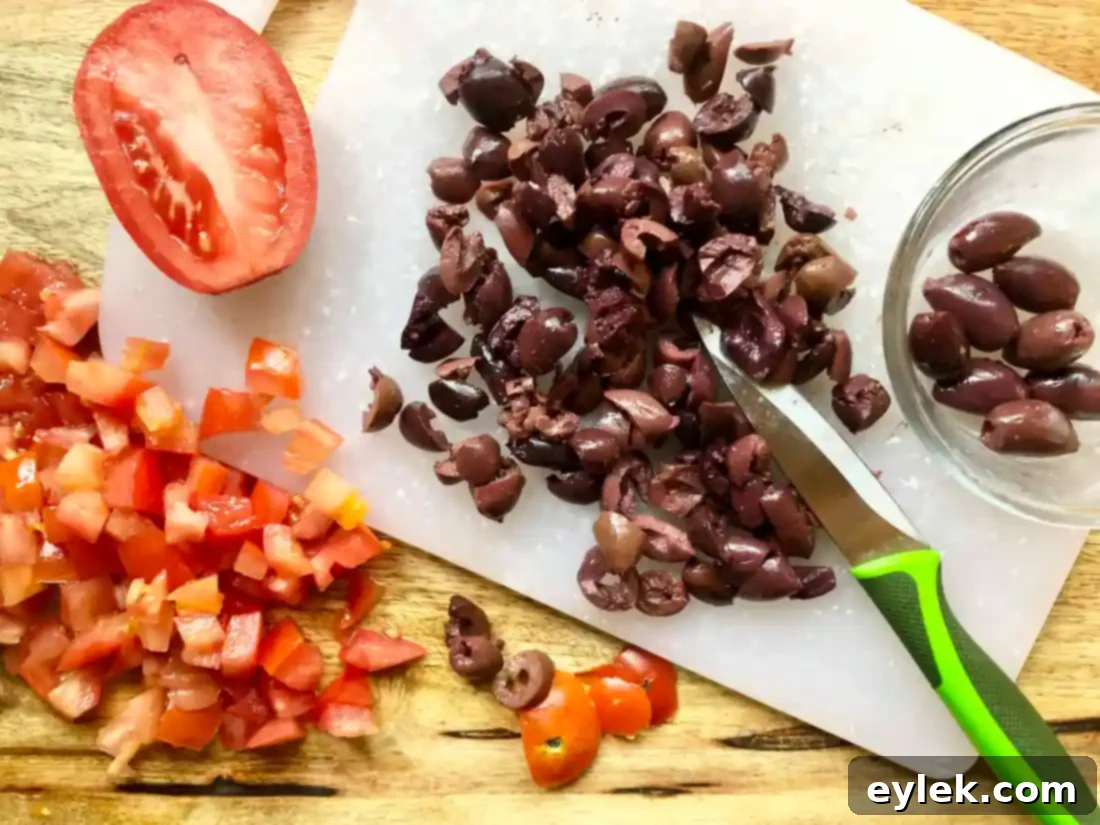 Diced tomatoes and chopped Kalamata olives for Pissaladière