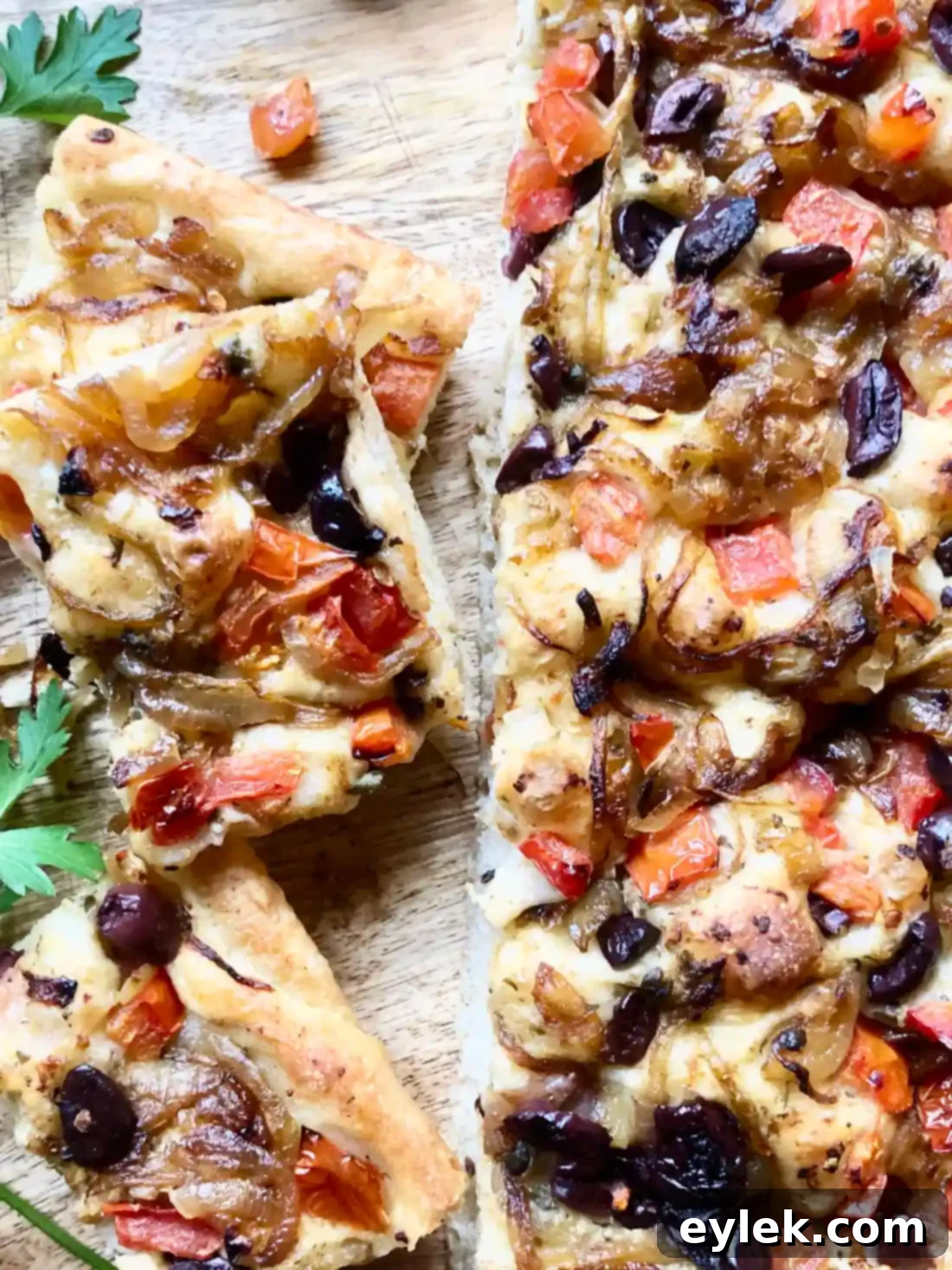 Pissaladière with Anchovies, Tomatoes & Olives, similar to focaccia bread, a sweet & savory treat loaded with crunch & chew. A Hint of Rosemary #ahintofrosemary #focacciabread #focaccia #pizza #flatbread #appetizers #snacks #vegetarian #bread #italian