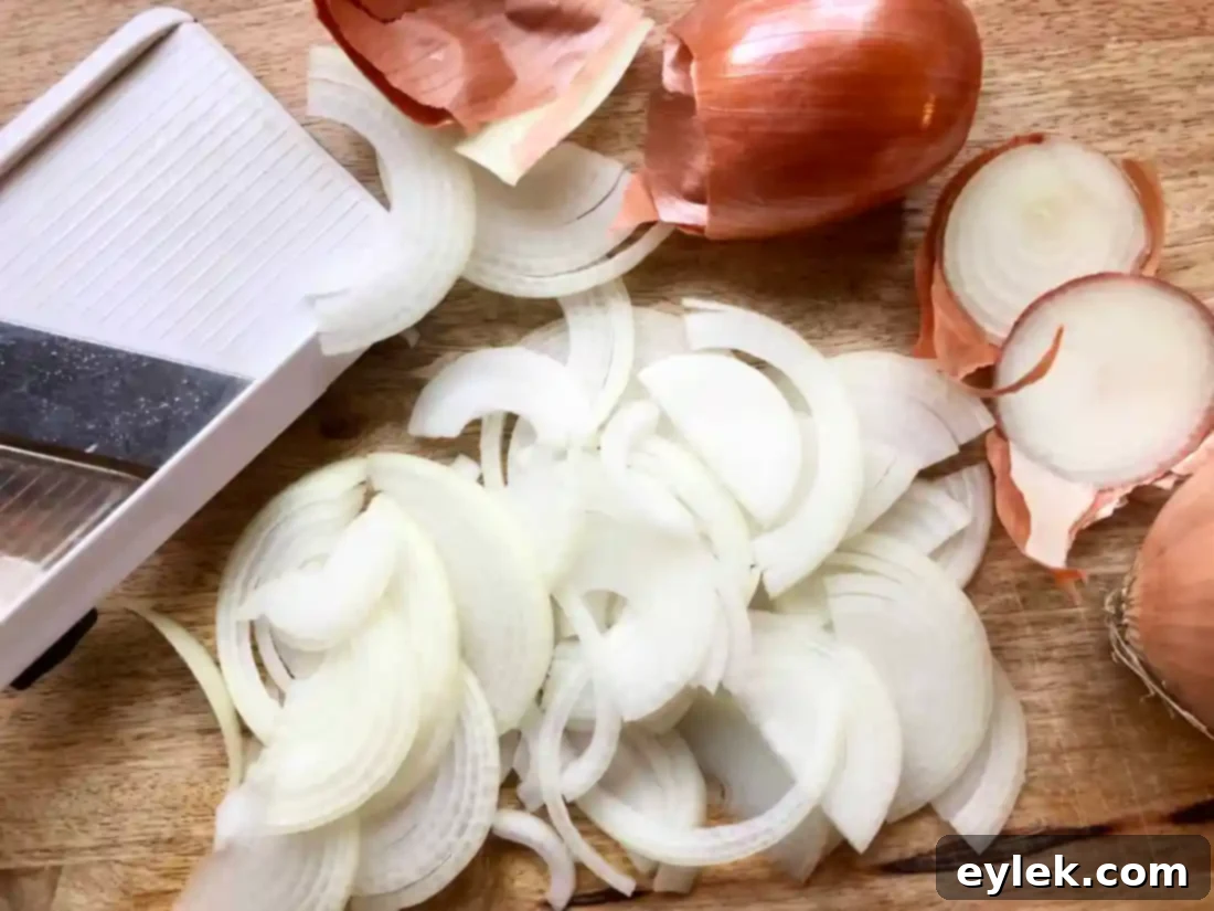 Sliced onions caramelizing in a sauté pan