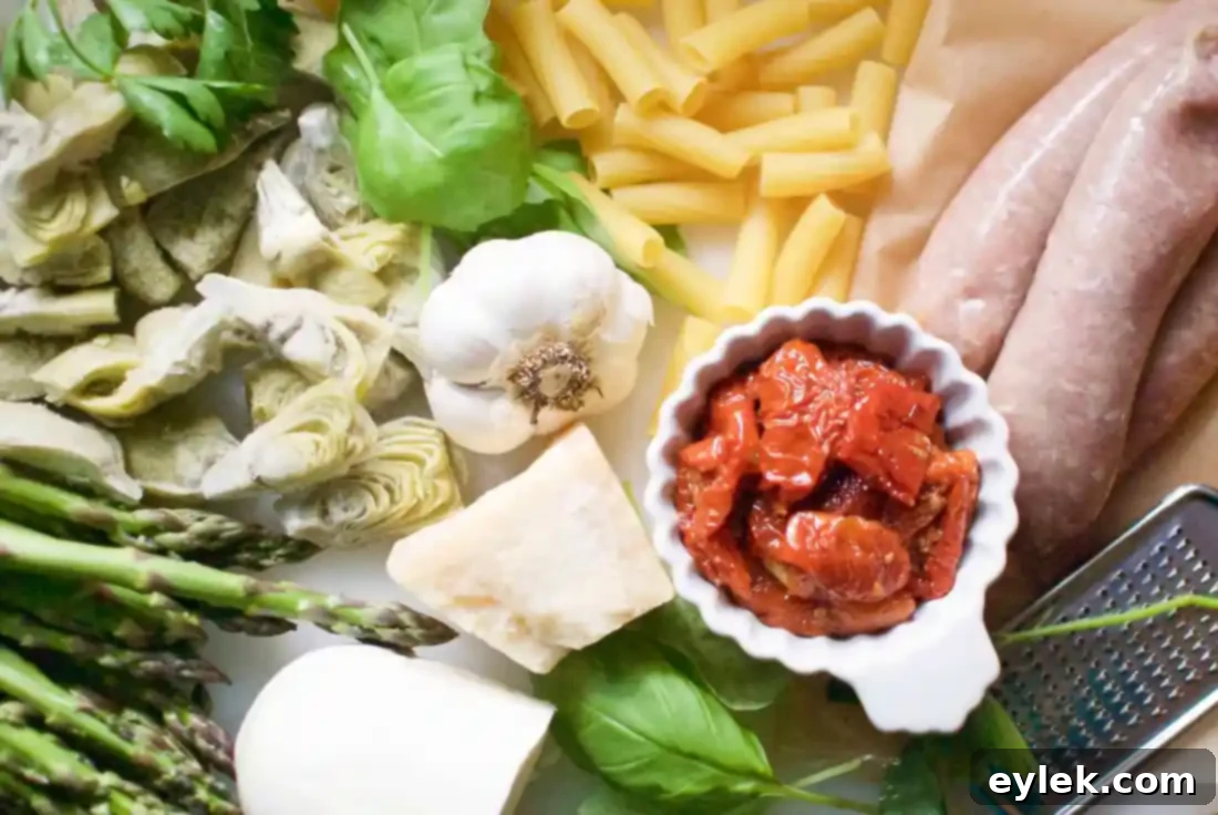 Hearty Rigatoni with Sausage, Artichokes & Asparagus in a deep pan, ready to serve
