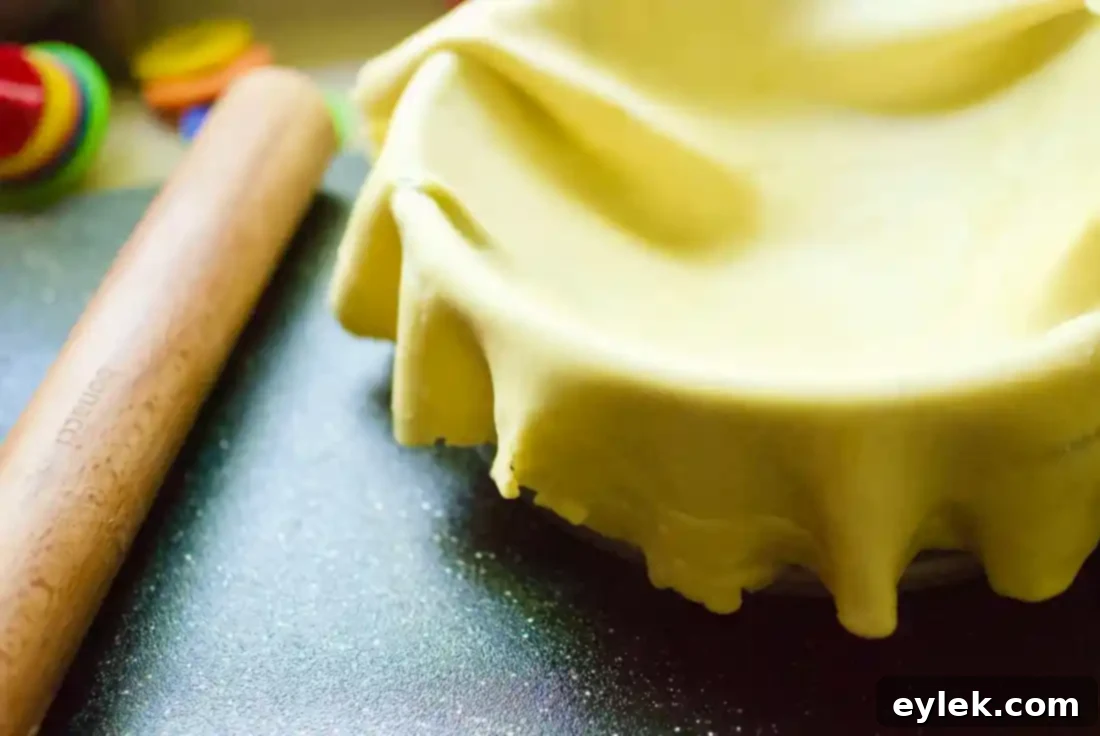 Pastry dough pressed into a springform pan with an overhang before trimming.