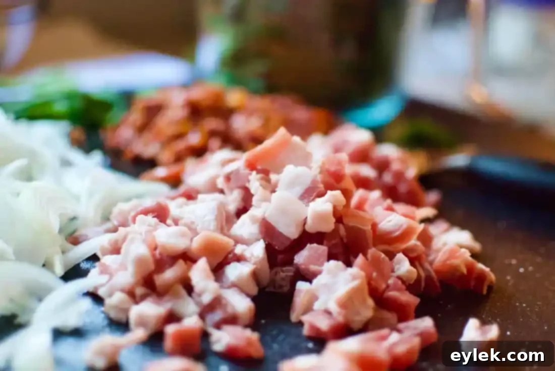 Diced pancetta waiting to be cooked in a bowl for the quiche filling.