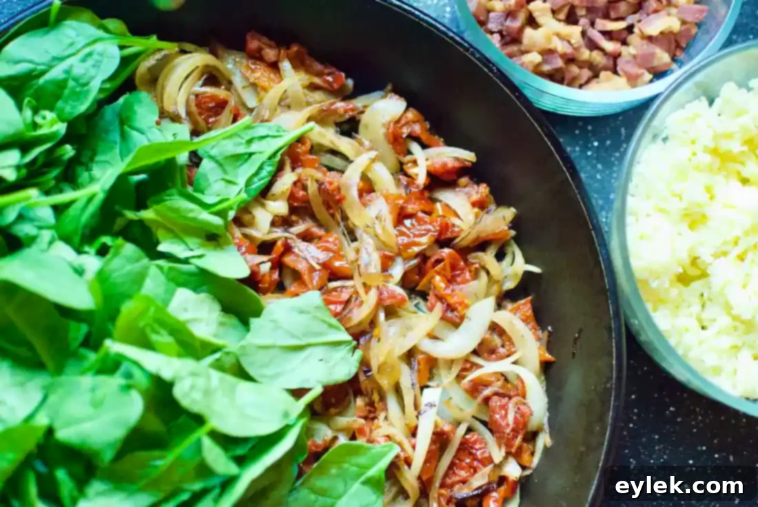 Cooked pancetta and thinly sliced onions in a skillet, gently sautéing.