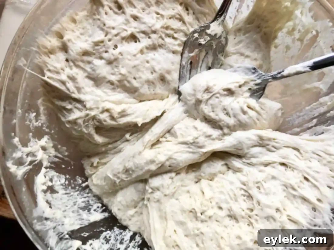 Separating dough into two equal pieces with forks