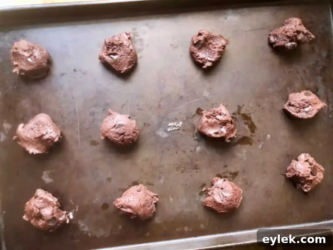 Freshly baked espresso chip cookies on baking sheet