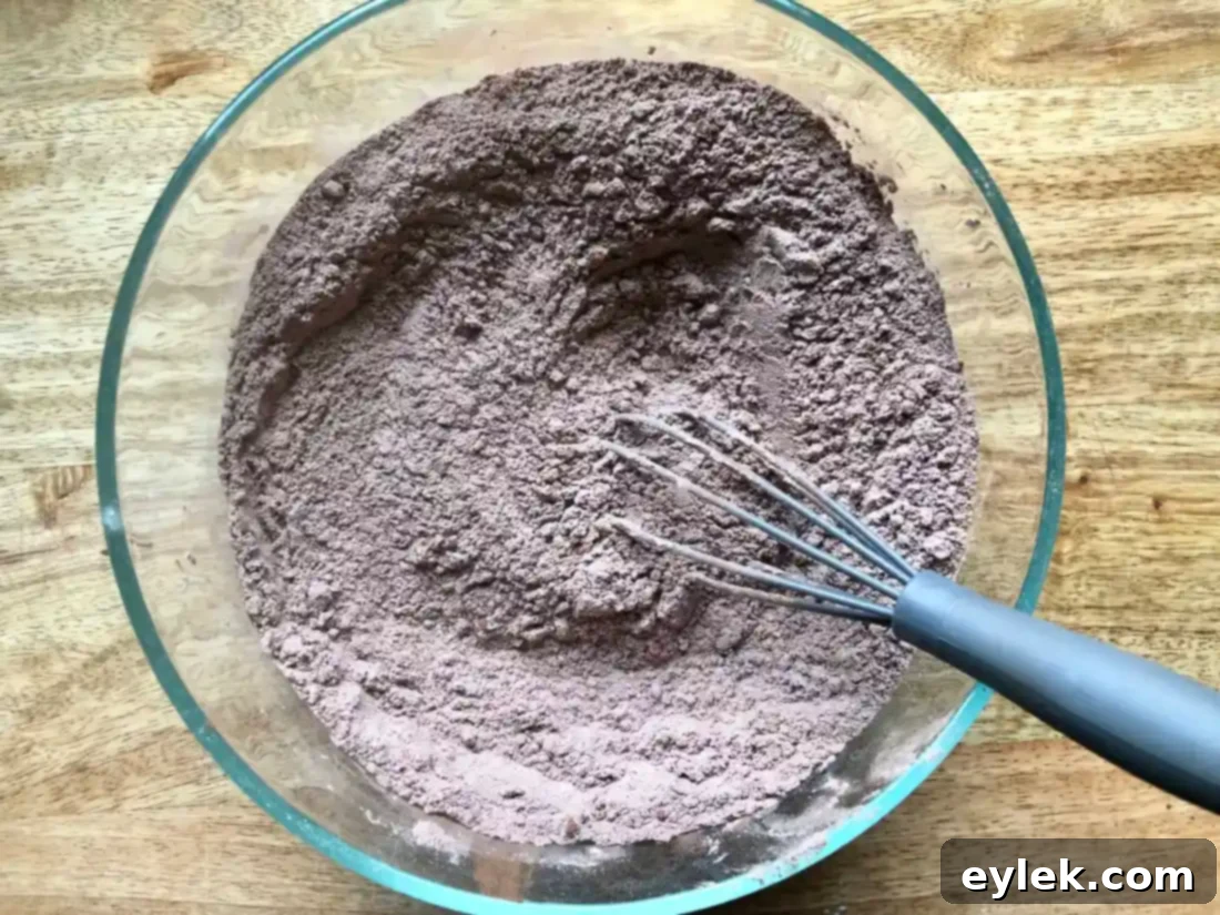 Beating sugar, eggs, and vanilla