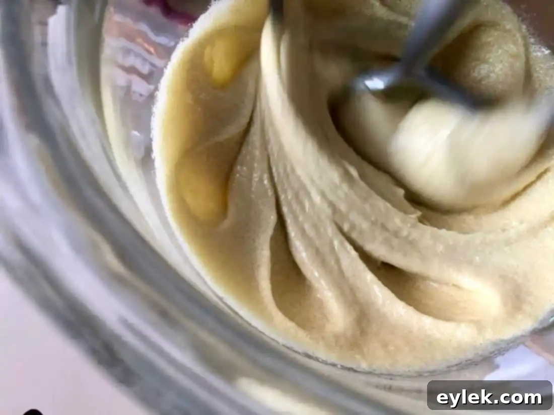 Adding flour mixture to cookie dough