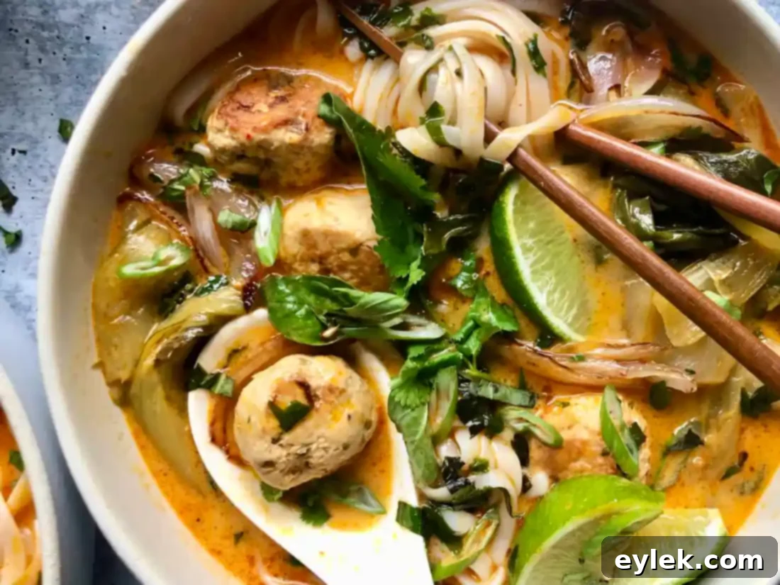 thai coconut curry noodle soup with chicken meatballs