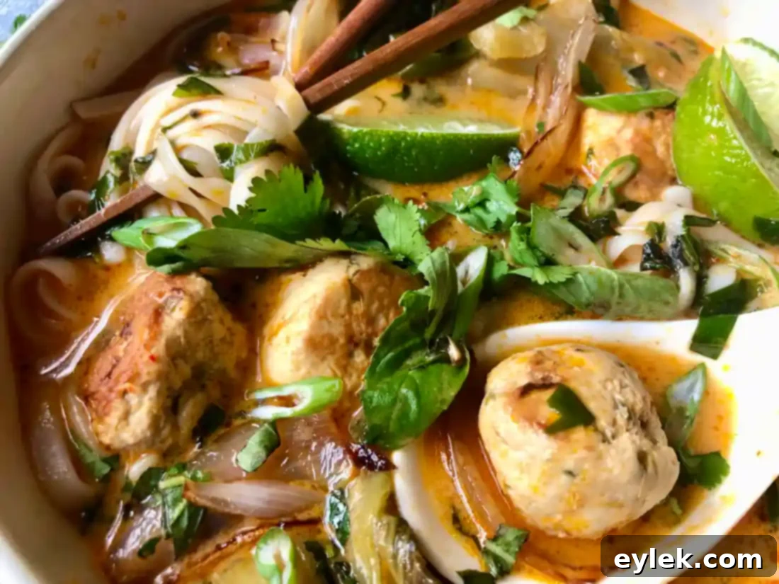 thai coconut curry noodle soup with chicken meatballs