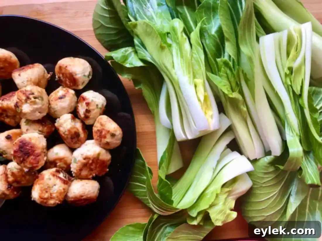 thai coconut curry noodle soup with chicken meatballs