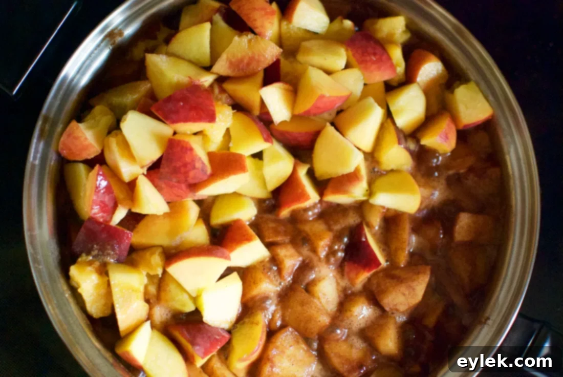 Adding peaches to the fruit mixture