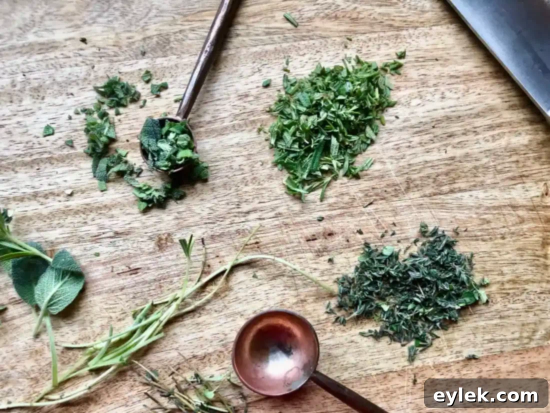 whisking eggs, milk, and herbs in a large bowl