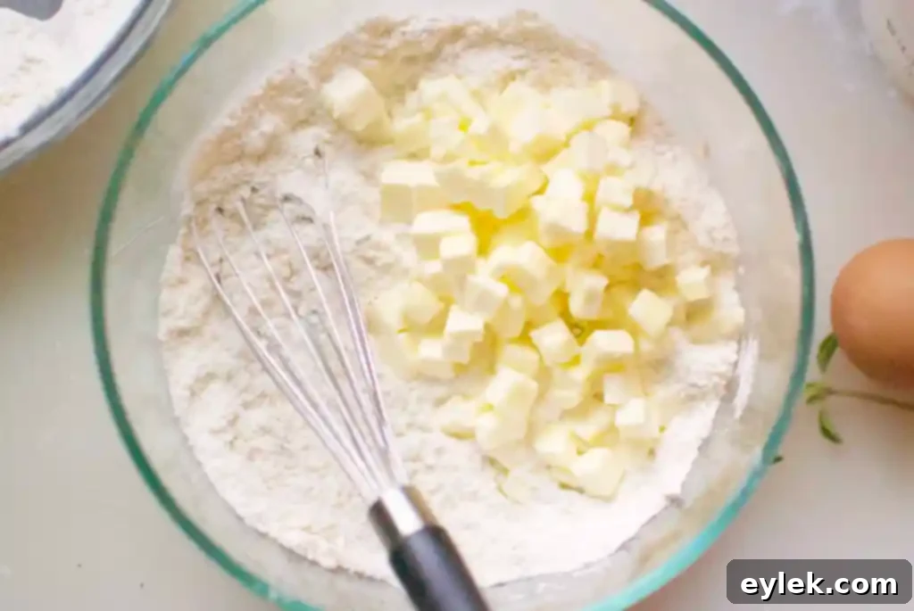 Muffin crumble topping being mixed by hand