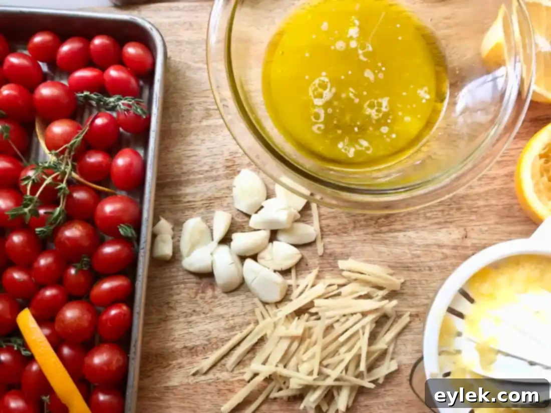 Tomatoes and seasoning on baking sheet before roasting