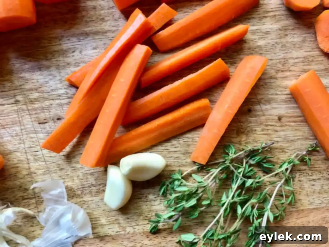 Two jars of partially filled pickled carrots with herbs and spices
