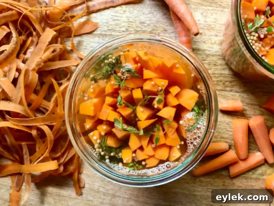 Pickled carrots in jars cooling on a countertop