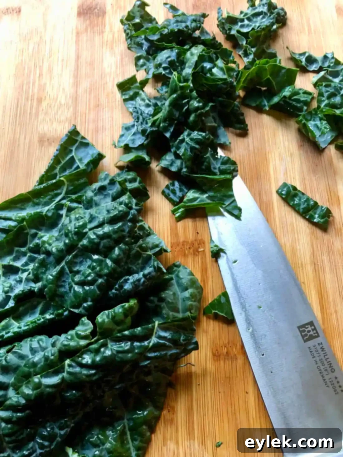 authentic homemade zuppa toscana - massaging kale