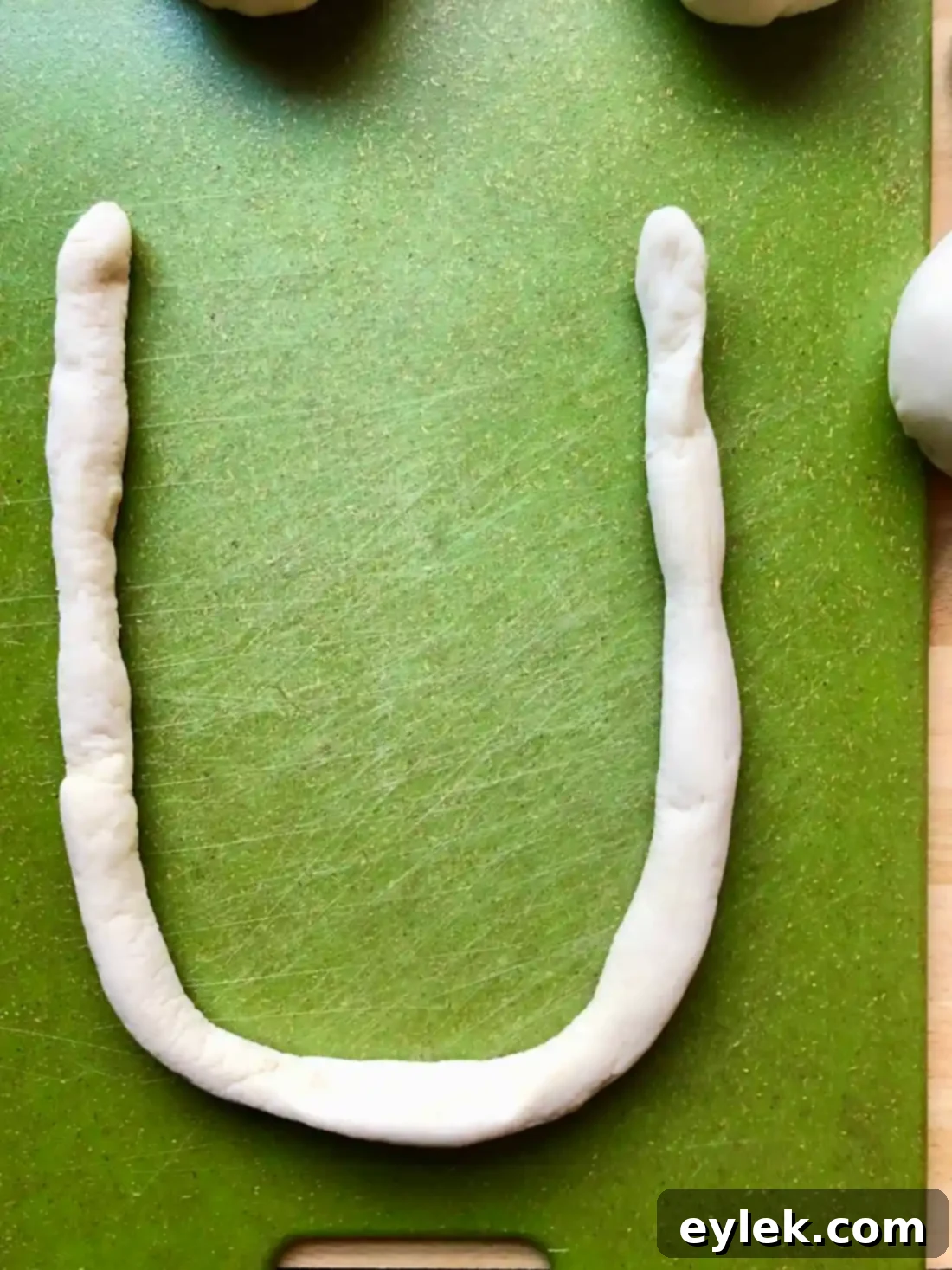 Quick and Easy Homemade Soft Pretzels 10 Pretzels boiling in a baking soda water bath
