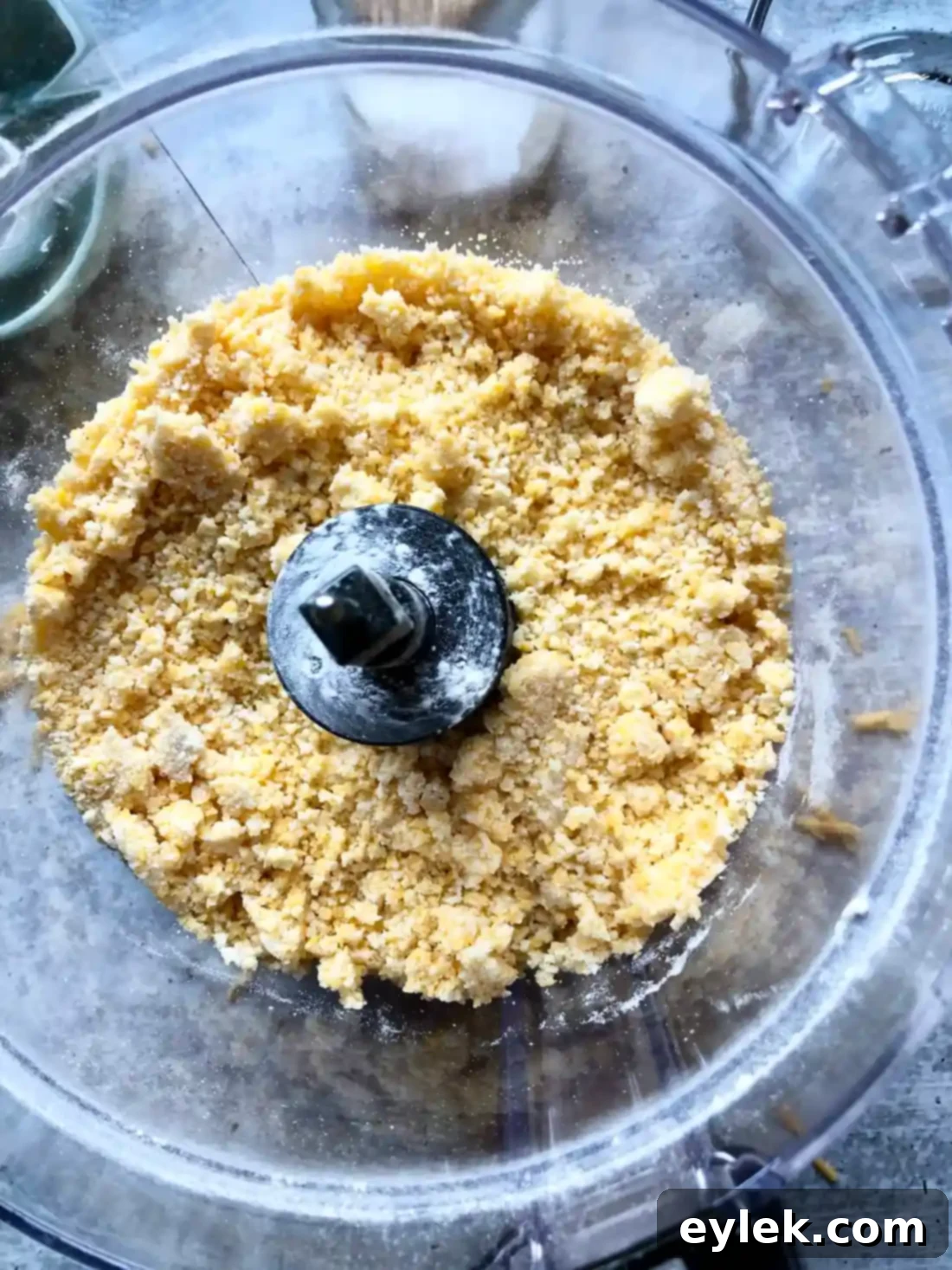 Dough forming large clumps in food processor