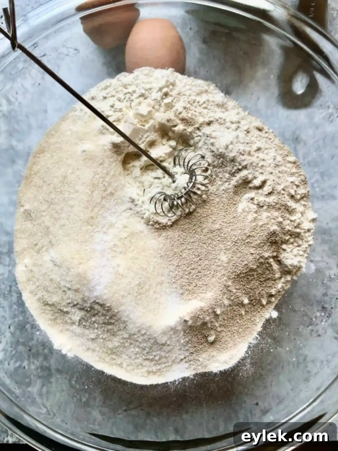 measuring flour for cheesy beef stuffed buns