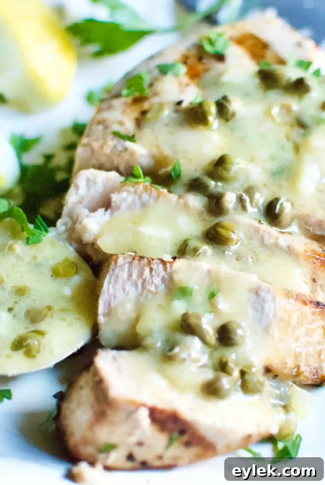 Vertical shot of Grilled Swordfish With Butter, Lemon & Caper Sauce