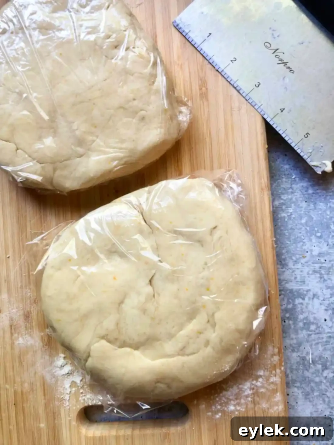 Buttermilk being added to pie dough mix for hand pies