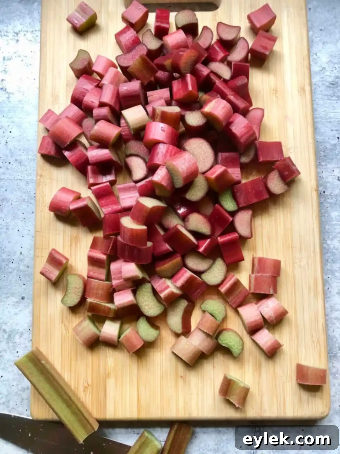Fresh rhubarb stalks cut into small chunks with sugar for filling