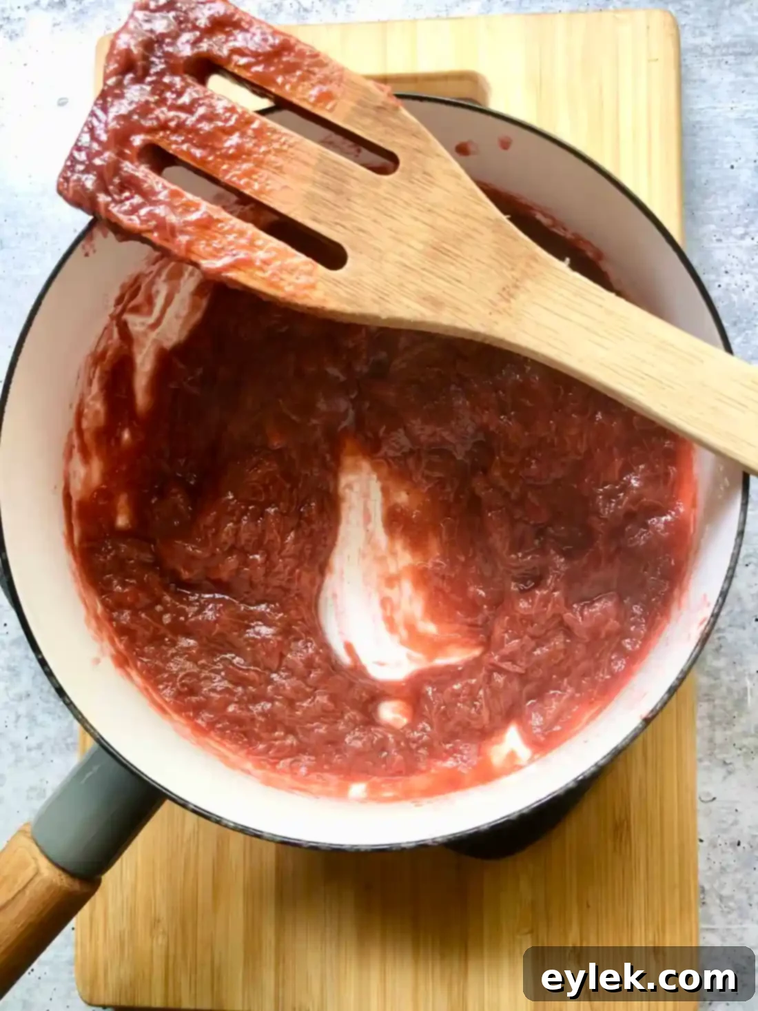 Thickened rhubarb filling after cooking, spread on a plate to cool