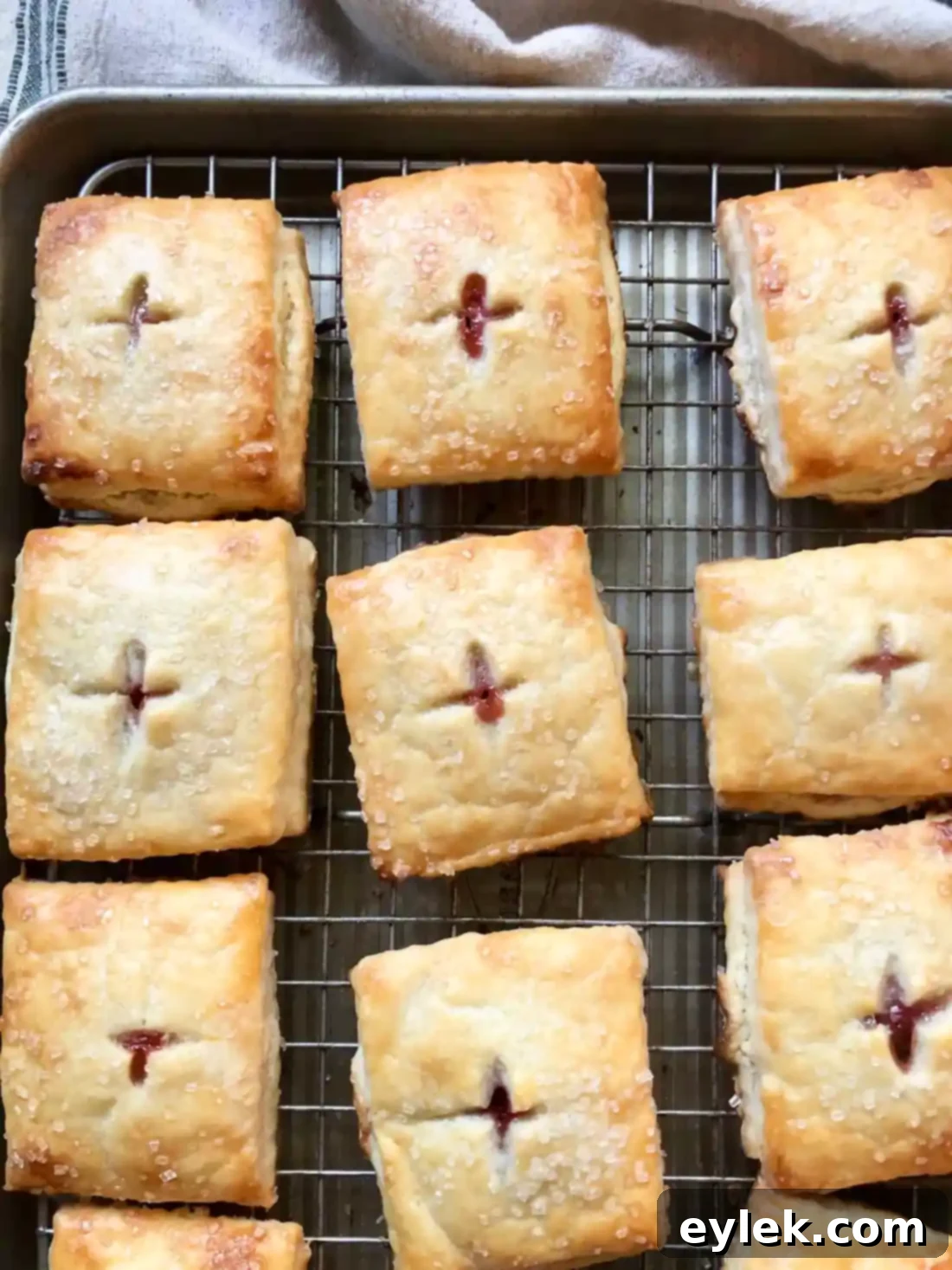 Baked Rhubarb & Cheese Hand Pies on a cooling rack