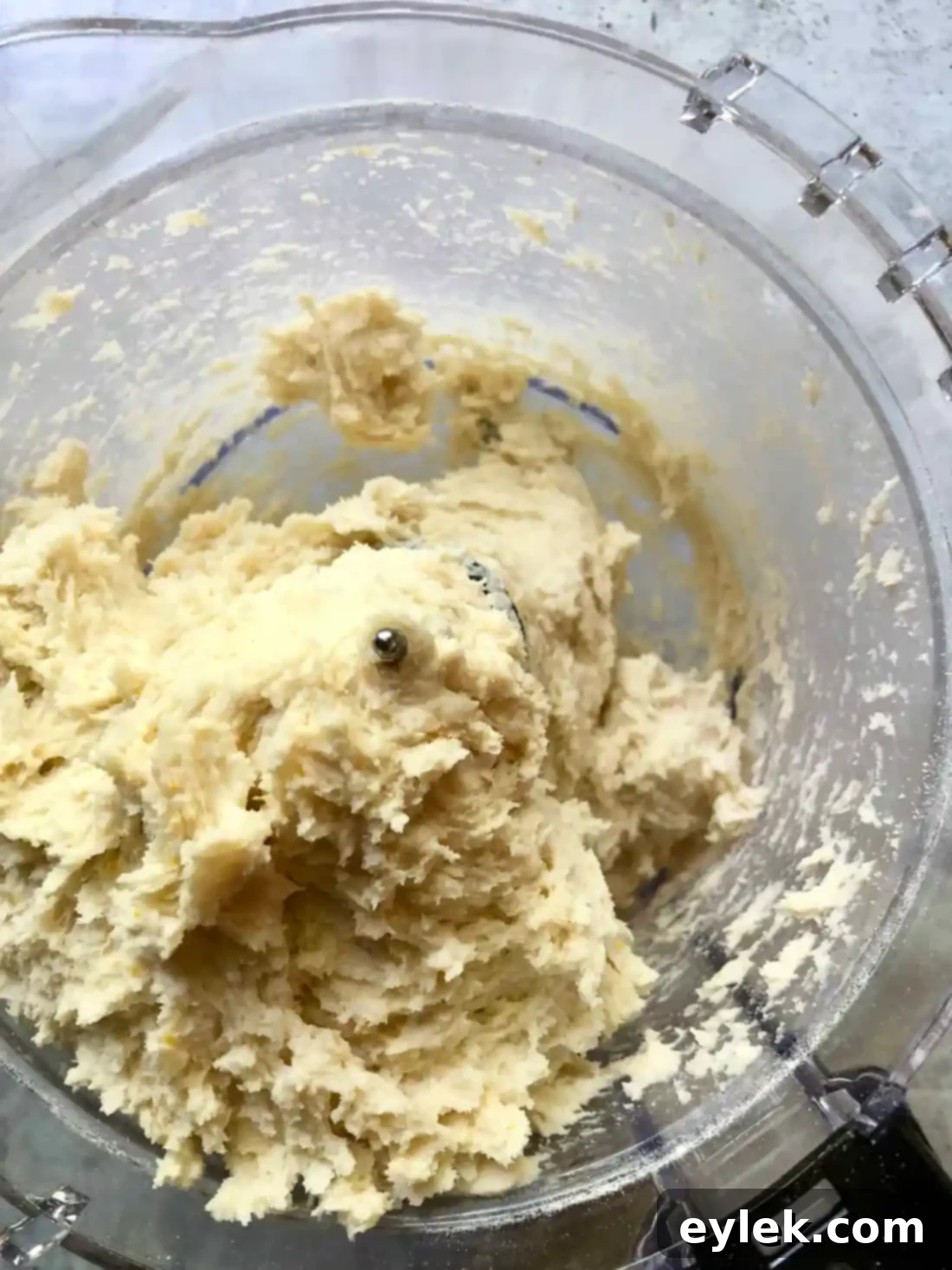 Buttermilk being added to dry ingredients for pie crust dough