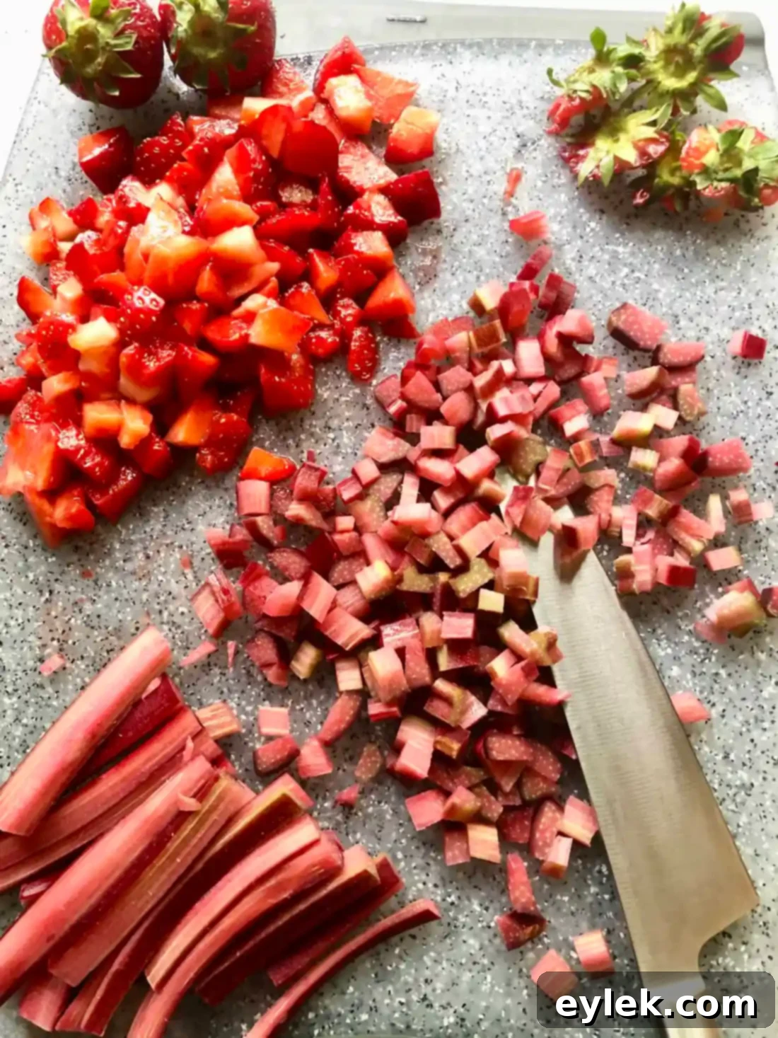 Mixing the strawberry and rhubarb with sugar and starch for the fruit topping.