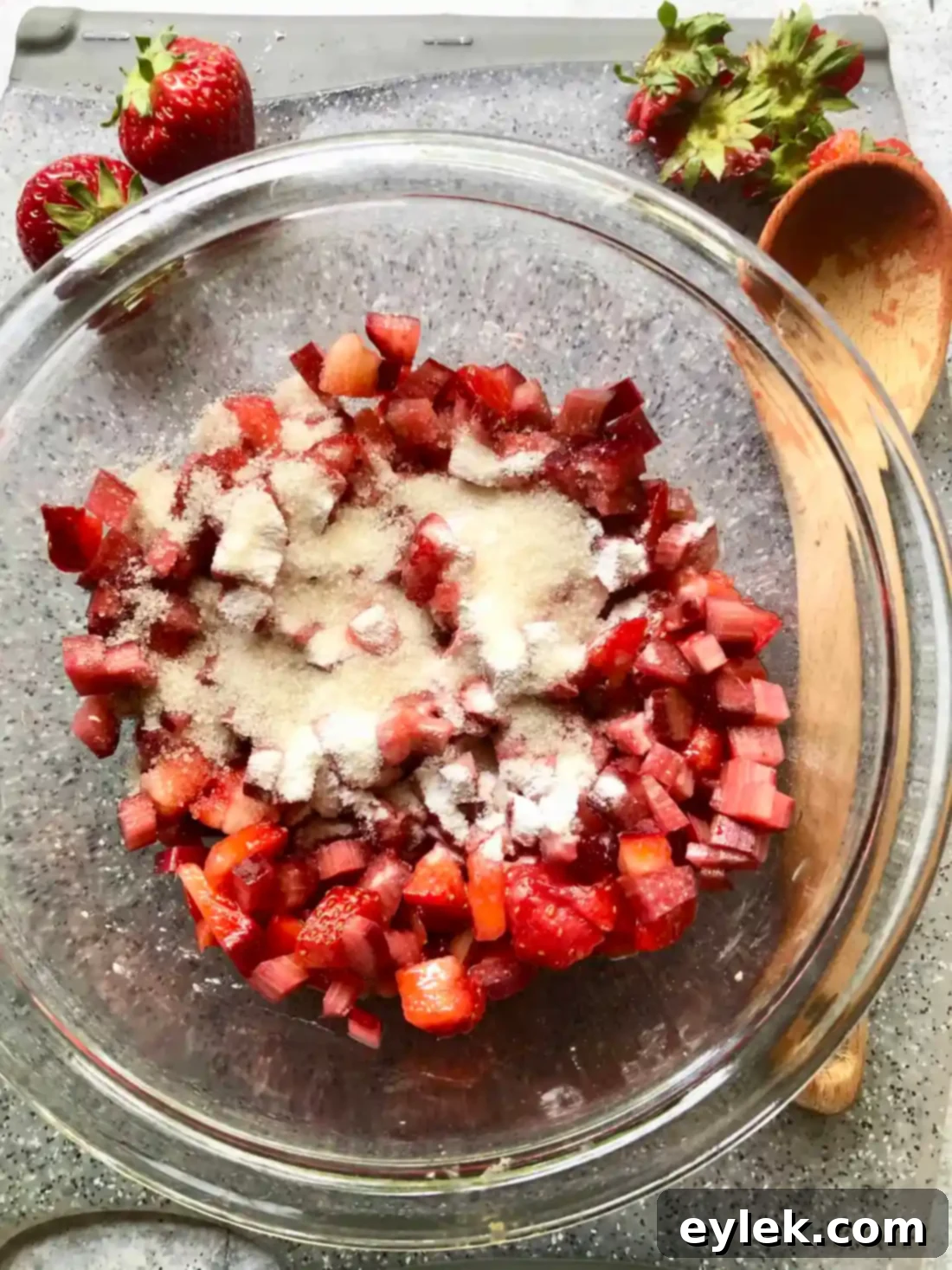 Spoon the strawberry rhubarb topping over the cheesecake.